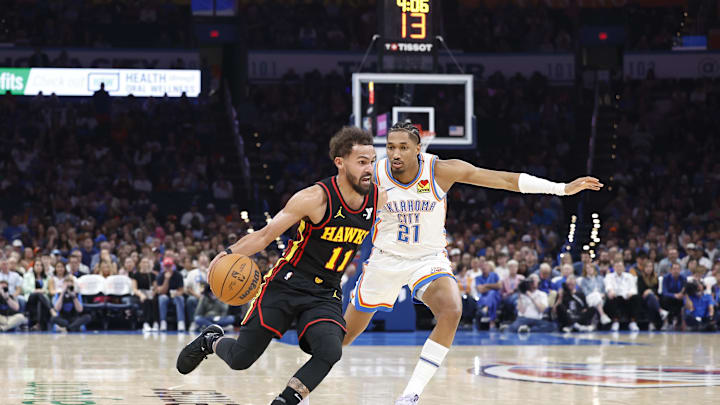 Oct 27, 2024; Oklahoma City, Oklahoma, USA; Atlanta Hawks guard Trae Young (11) drives to the basket around Oklahoma City Thunder guard Aaron Wiggins (21) during the second quarter at Paycom Center. Mandatory Credit: Alonzo Adams-Imagn Images Oct 27, 2024; Oklahoma City, Oklahoma, USA; Atlanta Hawks guard Trae Young (11) drives to the basket around Oklahoma City Thunder guard Aaron Wiggins (21) during the second quarter at Paycom Center. Mandatory Credit: Alonzo Adams-Imagn Images