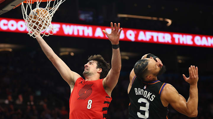 Apr 14, 2026; Phoenix, Arizona, USA; Portland Trail Blazers forward Deni Avdija (8) fouls Phoenix Suns forward Dillon Brooks (3) in the second half during the play-in rounds of the 2026 NBA Playoffs at Mortgage Matchup Center. Mandatory Credit: Mark J. Rebilas-Imagn Images Apr 14, 2026; Phoenix, Arizona, USA; Portland Trail Blazers forward Deni Avdija (8) fouls Phoenix Suns forward Dillon Brooks (3) in the second half during the play-in rounds of the 2026 NBA Playoffs at Mortgage Matchup Center. Mandatory Credit: Mark J. Rebilas-Imagn Images