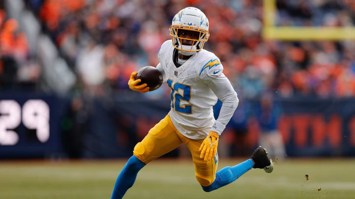 Dec 31, 2023; Denver, Colorado, USA; Los Angeles Chargers wide receiver Derius Davis (12) runs the ball in the second quarter against the Denver Broncos at Empower Field at Mile High. Mandatory Credit: Isaiah J. Downing-USA TODAY Sports