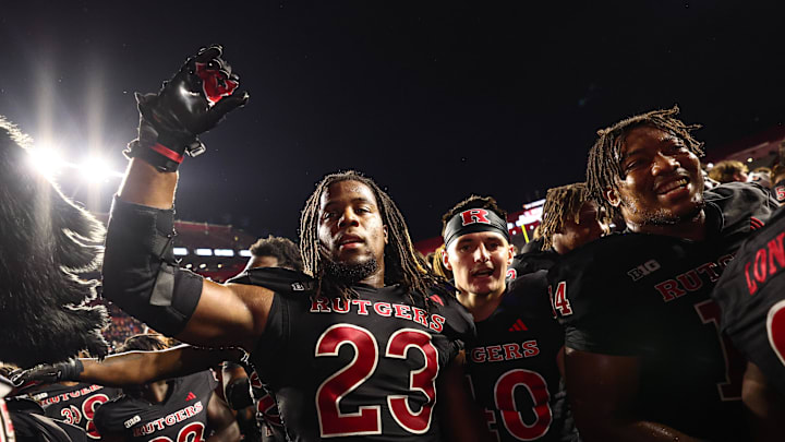 The Rutgers Scarlet Knights celebrate a home win over Washington. 
