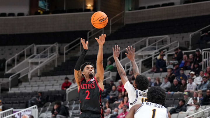Dec 21, 2024; San Jose, California, USA; San Diego State Aztecs guard Nick Boyd (2) shoots against California Golden Bears guard Jovan Blacksher Jr. (right back) during the first half at SAP Center. Mandatory Credit: Darren Yamashita-Imagn Images