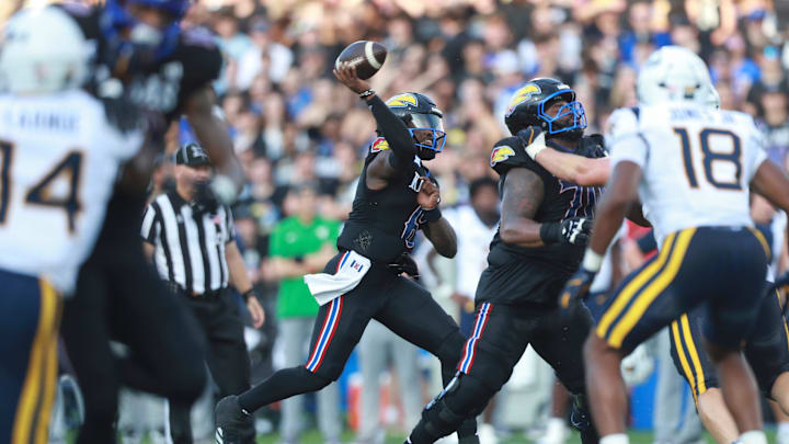 Kansas Jayhawks quarterback Jalon Daniels (6) throws a pass during the first half of the game against West Virginia Mountaineers at David Booth Kansas Memorial Stadium on Sept. 20, 2025.