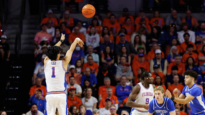 Feb 14, 2026; Gainesville, Florida, USA; Florida Gators guard Xaivian Lee (1) makes a three point basket over Kentucky Wildcats guard Collin Chandler (5) during the first half at Exactech Arena at the Stephen C. O'Connell Center. Mandatory Credit: Matt Pendleton-Imagn Images Feb 14, 2026; Gainesville, Florida, USA; Florida Gators guard Xaivian Lee (1) makes a three point basket over Kentucky Wildcats guard Collin Chandler (5) during the first half at Exactech Arena at the Stephen C. O'Connell Center. Mandatory Credit: Matt Pendleton-Imagn Images