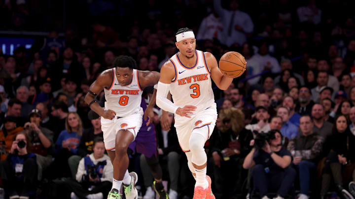 Jan 8, 2025; New York, New York, USA; New York Knicks guard Josh Hart (3) brings the ball up court against the Toronto Raptors with forward OG Anunoby (8) during the third quarter at Madison Square Garden. Mandatory Credit: Brad Penner-Imagn Images
