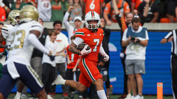 Nov 9, 2024; Atlanta, Georgia, USA; Miami Hurricanes wide receiver Xavier Restrepo (7) catches a pass for a touchdown against the Georgia Tech Yellow Jackets in the fourth quarter at Bobby Dodd Stadium at Hyundai Field. 