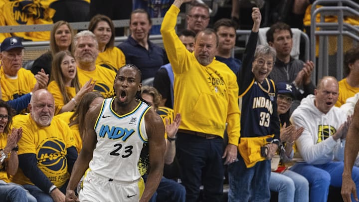 Apr 19, 2025; Indianapolis, Indiana, USA;  Indiana Pacers forward Aaron Nesmith (23) celebrates a made basket  in the first half against the Milwaukee Bucks at Gainbridge Fieldhouse. Mandatory Credit: Trevor Ruszkowski-Imagn Images