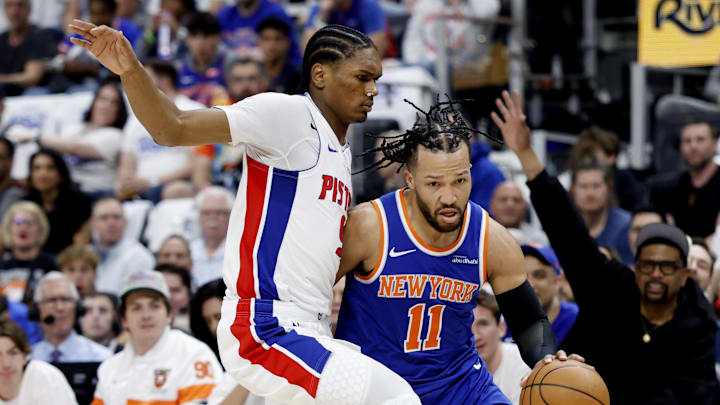 Apr 24, 2025; Detroit, Michigan, USA; New York Knicks guard Jalen Brunson (11) dribbles defended by Detroit Pistons forward Ausar Thompson (9) in the first half during game three of first round for the 2024 NBA Playoffs at Little Caesars Arena. Mandatory Credit: Rick Osentoski-Imagn Images