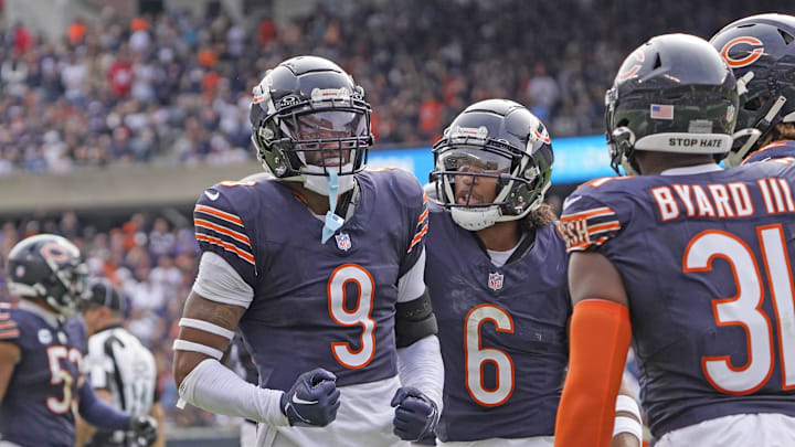 Jaquan Brisker (9) celebrates a stop with teammates during the win by the Bears over the L.A. Rams.