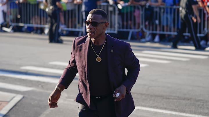 Hall of Famer Rickey Henderson arrives at the National Baseball Hall of Fame during the Parade of Legends in 2023.