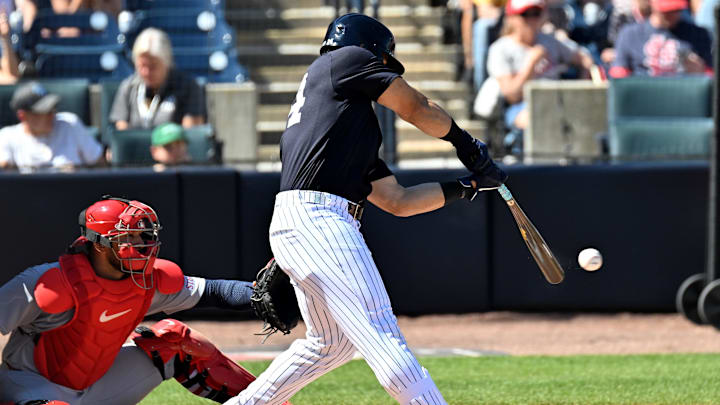 New York Yankees left fielder Jasson Dominguez (24) hits a RBI single in the third inning against the St. Louis Cardinals during spring training at George M. Steinbrenner Field on Feb 26. New York Yankees left fielder Jasson Dominguez (24) hits a RBI single in the third inning against the St. Louis Cardinals during spring training at George M. Steinbrenner Field on Feb 26.