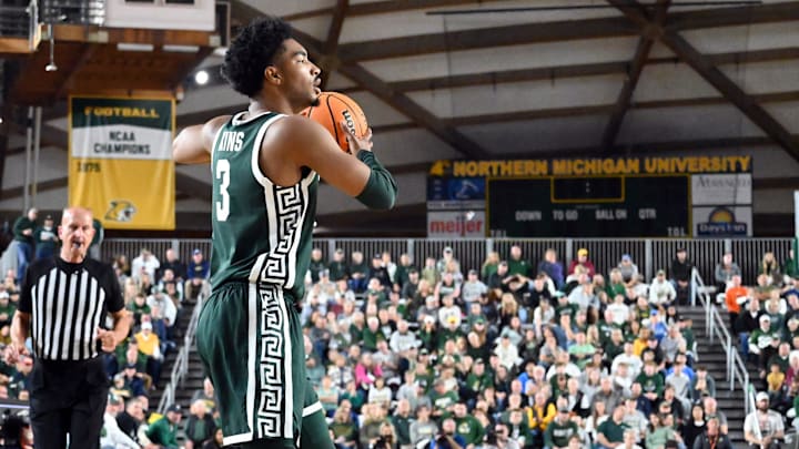 Michigan State senior Jaden Akins looks for an open teammate during the Spartans' exhibition game against Northern Michigan on Sunday, Oct. 13, 2024, in Marquette. MSU coach Tom Izzo, a 1977 NMU graduate, was also honored with his jersey No. 10 being retired during the game.
