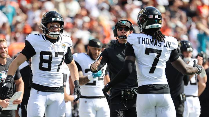 Oct 4, 2026; Cincinnati, Ohio, USA; Jacksonville Jaguars defensive end Bryan Thomas Jr. (7) reacts with tight end Nate Boerkircher (87) and head coach Liam Coen after scoring a touchdown during the second quarter at Paycor Stadium. Mandatory Credit: Joseph Maiorana-Imagn Images Oct 4, 2026; Cincinnati, Ohio, USA; Jacksonville Jaguars defensive end Bryan Thomas Jr. (7) reacts with tight end Nate Boerkircher (87) and head coach Liam Coen after scoring a touchdown during the second quarter at Paycor Stadium. Mandatory Credit: Joseph Maiorana-Imagn Images