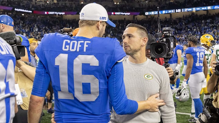 Nov 23, 2023; Detroit, Michigan, USA; Green Bay Packers Head Coach Matt LaFleur talks to Detroit Lions quarterback Jared Goff (16) after the annual Thanksgiving Day game at Ford Field. Mandatory Credit: David Reginek-Imagn Images