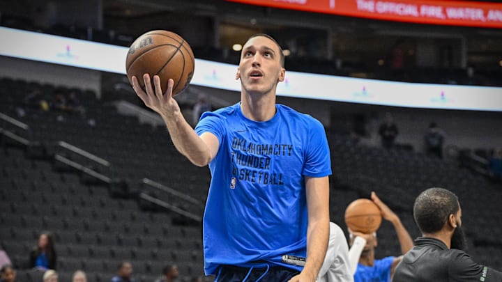 Dec 2, 2023; Dallas, Texas, USA; Oklahoma City Thunder forward Aleksej Pokusevski (17) warms up before the game between the Dallas Mavericks and the Oklahoma City Thunder  at the American Airlines Center. Mandatory Credit: Jerome Miron-Imagn Images