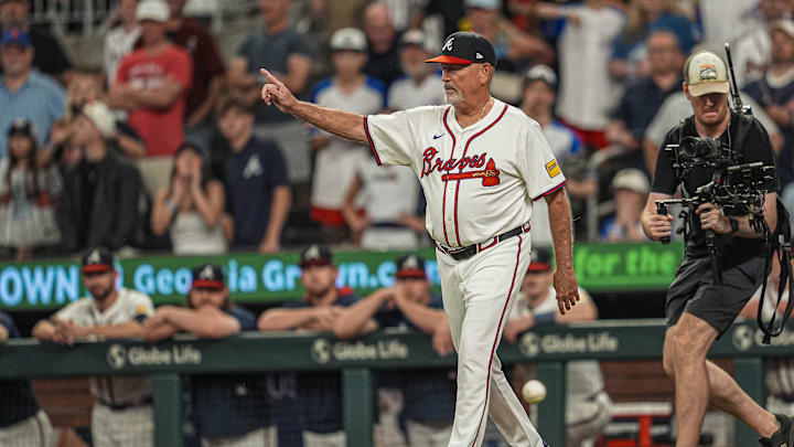 Jun 18, 2025; Cumberland, Georgia, USA; Atlanta Braves manager Brian Snitker (43) walks to the mound to replace starting pitcher Chris Sale (51) (not shown) against the New York Mets during the ninth inning at Truist Park. Mandatory Credit: Dale Zanine-Imagn Images