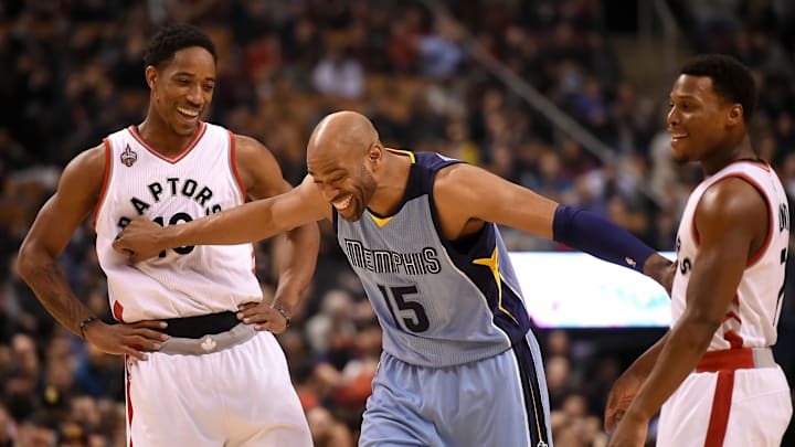 Feb 21, 2016; Toronto, Ontario, CAN;  Memphis Grizzlies guard Vince Carter (15) jokes with Toronto Raptors guards DeMar DeRozan (10) and Kyle Lowry (7) during the first quarter at Air Canada Centre. Mandatory Credit: Dan Hamilton-Imagn Images
