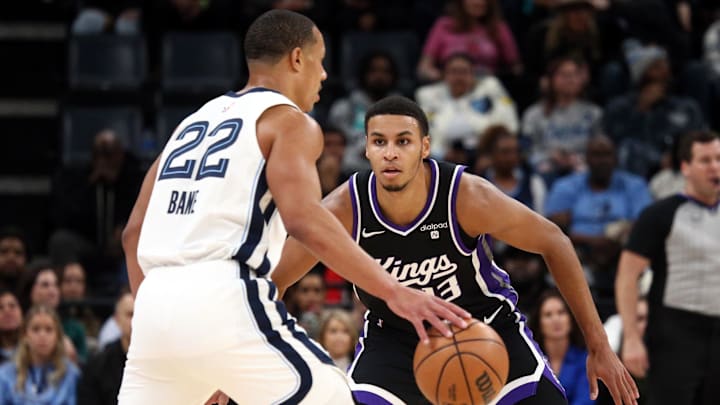 Dec 31, 2023; Memphis, Tennessee, USA; Sacramento Kings forward Keegan Murray (13) defends Memphis Grizzlies guard Desmond Bane (22) during the first half at FedExForum. Mandatory Credit: Petre Thomas-Imagn Images