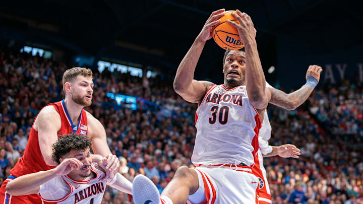 Mar 8, 2025; Lawrence, Kansas, USA; Arizona Wildcats forward Tobe Awaka (30) rebounds during the second half against the Kansas Jayhawks at Allen Fieldhouse. Mandatory Credit: William Purnell-Imagn Images
