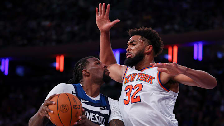 Oct 13, 2024; New York, New York, USA; New York Knicks center Karl-Anthony Towns (32) fouls Minnesota Timberwolves center Naz Reid (11) during the second half at Madison Square Garden. Mandatory Credit: Vincent Carchietta-Imagn Images