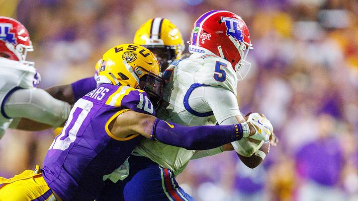 Sep 12, 2026; Baton Rouge, Louisiana, USA; LSU Tigers safety Dashawn Spears (10) tackles Louisiana Tech Bulldogs quarterback Blake Baker (5) during the second half at Tiger Stadium. Mandatory Credit: Stephen Lew-Imagn Images Sep 12, 2026; Baton Rouge, Louisiana, USA; LSU Tigers safety Dashawn Spears (10) tackles Louisiana Tech Bulldogs quarterback Blake Baker (5) during the second half at Tiger Stadium. Mandatory Credit: Stephen Lew-Imagn Images