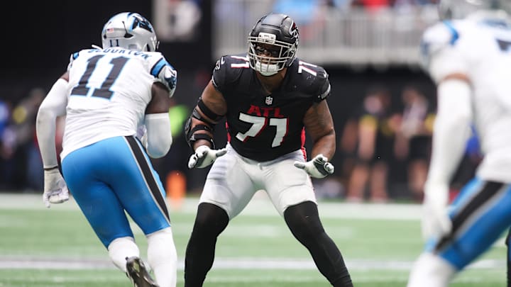 Nov 16, 2025; Atlanta, Georgia, USA; Atlanta Falcons offensive lineman Elijah Wilkinson (71) defends Carolina Panthers outside linebacker Nic Scourton (11) in the second quarter at Mercedes-Benz Stadium. Mandatory Credit: Brett Davis-Imagn Images Nov 16, 2025; Atlanta, Georgia, USA; Atlanta Falcons offensive lineman Elijah Wilkinson (71) defends Carolina Panthers outside linebacker Nic Scourton (11) in the second quarter at Mercedes-Benz Stadium. Mandatory Credit: Brett Davis-Imagn Images