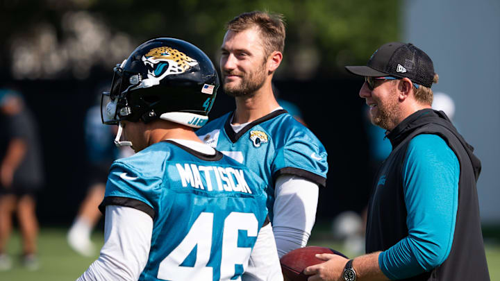 Jacksonville Jaguars head coach Liam Coen, right, talks with Jacksonville Jaguars long snapper Ross Matiscik (46) and Jacksonville Jaguars punter Logan Cooke (9) during the Jacksonville Jaguars’ third mandatory minicamp Thursday June 12, 2025 at the Miller Electric Center in Jacksonville, Fla. [Doug Engle/Florida Times-Union]