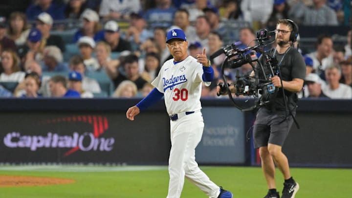 Oct 28, 2025; Los Angeles, California, USA; Los Angeles Dodgers manager Dave Roberts (30) makes a pitching change during the seventh inning against the Toronto Blue Jays during game four of the 2025 MLB World Series at Dodger Stadium. Mandatory Credit: Jayne Kamin-Oncea-Imagn Images