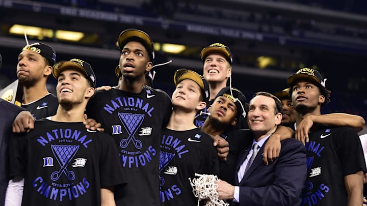 Apr 6, 2015; Indianapolis, IN, USA; Duke Blue Devils head coach Mike Krzyzewski and his players including Quinn Cook watch "One Shining Moment" after defeating the Wisconsin Badgers in the 2015 NCAA Men's Division I Championship game at Lucas Oil Stadium. Mandatory Credit: Bob Donnan-Imagn Images
