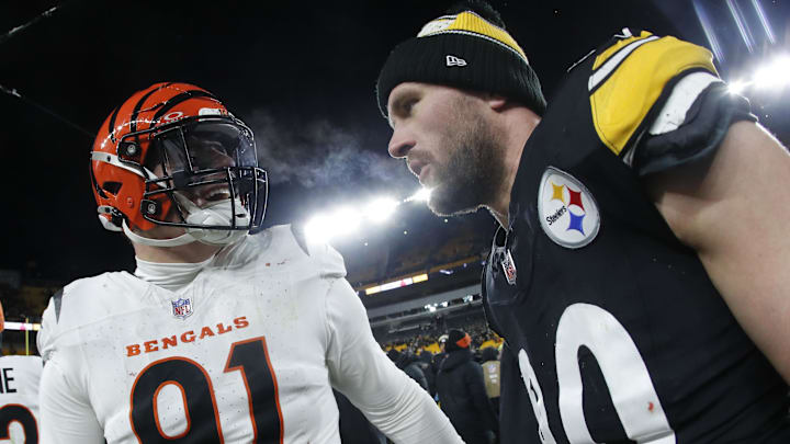 Jan 4, 2025; Pittsburgh, Pennsylvania, USA;  Cincinnati Bengals defensive end Trey Hendrickson (91) and Pittsburgh Steelers linebacker T.J. Watt (90) talk after the game at Acrisure Stadium. Mandatory Credit: Charles LeClaire-Imagn Images