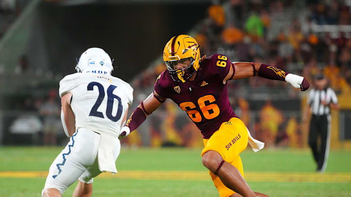 September 1, 2022; Tempe, Arizona; USA; ASU linebacker James Djonkam (66) tackles NAU runningback Draycen Hall (26) during a game at Sun Devil Stadium.

Football Asu Fb Nau At Asu