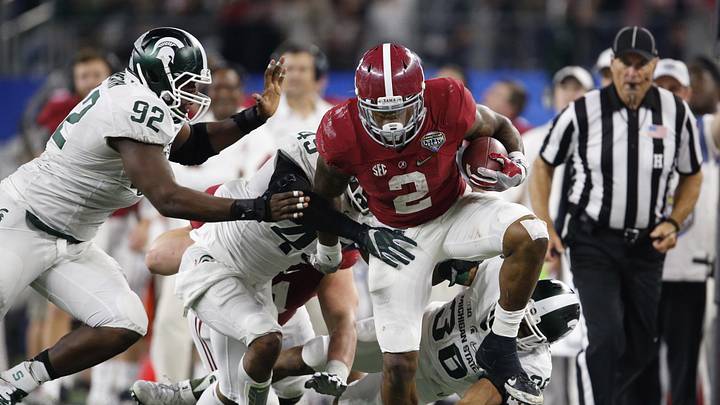 Dec 31, 2015; Arlington, TX, USA; Alabama Crimson Tide running back Derrick Henry (2) runs with the ball against  Michigan State Spartans linebacker Darien Harris (45) defensive end Joel Heath (92) and cornerback Arjen Colquhoun (36) in the third quarter in the 2015 CFP semifinal at the Cotton Bowl at AT&T Stadium. Mandatory Credit: Matthew Emmons-Imagn Images
