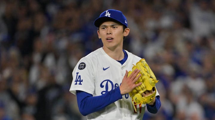 Los Angeles Dodgers pitcher Roki Sasaki (11) reacts to the final out against the Cincinnati Reds during game two of the Wildcard round for the 2025 MLB playoffs at Dodger Stadium on Oct. 1.