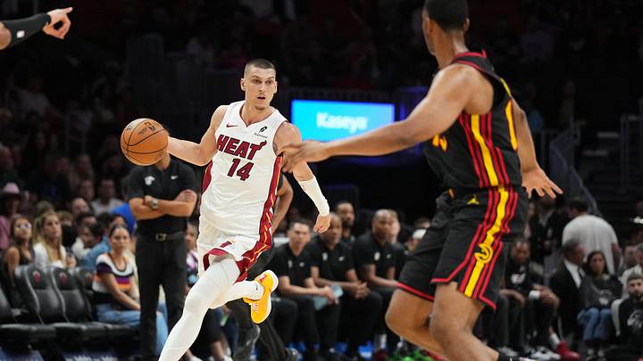 Apr 12, 2026; Miami, Florida, USA;  Miami Heat guard Tyler Herro (14) dribbles against Atlanta Hawks forward Asa Newell (14) during the second half at Kaseya Center. Mandatory Credit: Jim Rassol-Imagn Images