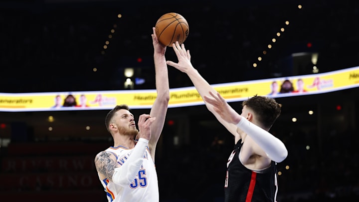 Nov 20, 2024; Oklahoma City, Oklahoma, USA; Oklahoma City Thunder center Isaiah Hartenstein (55) shoots over Portland Trail Blazers center Donovan Clingan (23) during the second half at Paycom Center. Mandatory Credit: Alonzo Adams-Imagn Images Nov 20, 2024; Oklahoma City, Oklahoma, USA; Oklahoma City Thunder center Isaiah Hartenstein (55) shoots over Portland Trail Blazers center Donovan Clingan (23) during the second half at Paycom Center. Mandatory Credit: Alonzo Adams-Imagn Images