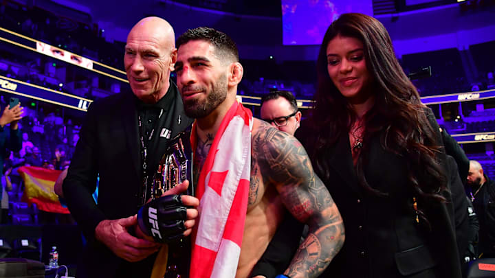 Feb 17, 2024; Anaheim, California, USA; Ilia Topuria celebrates his championship victory against Alexander Volkanovski during UFC 298 at Honda Center. Mandatory Credit: Gary A. Vasquez-Imagn Images