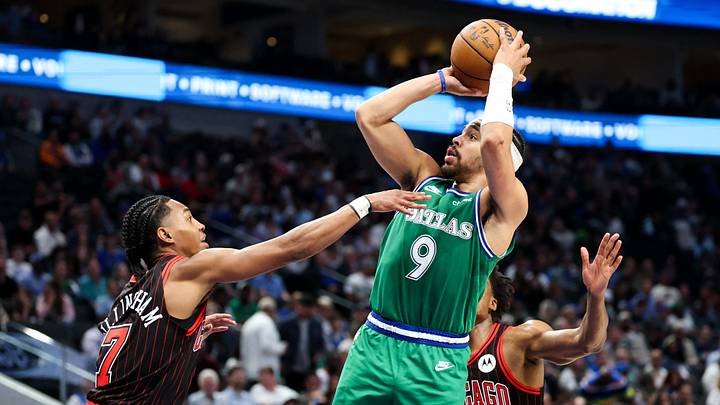 Apr 12, 2026; Dallas, Texas, USA; Dallas Mavericks guard Ryan Nembhard (9) shoots as Chicago Bulls guard Rob Dillingham (7) defends during the second half at American Airlines Center. Apr 12, 2026; Dallas, Texas, USA; Dallas Mavericks guard Ryan Nembhard (9) shoots as Chicago Bulls guard Rob Dillingham (7) defends during the second half at American Airlines Center.