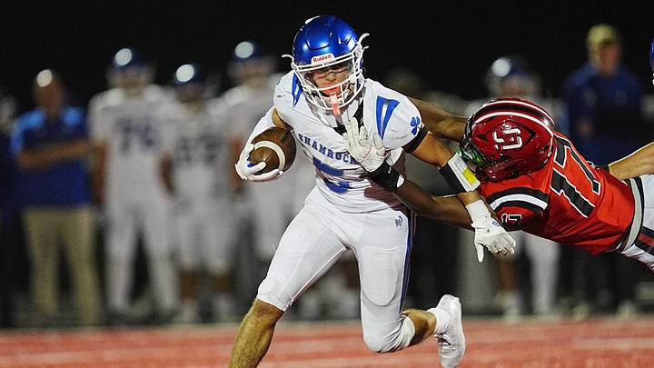 Detroit Catholic Central Shamrocks Ryan Jaafar (5) runs for yardage against Orchard Lake St. Mary's Joshua Gonzales (17) during the second half of the MHSAA game at Orchard Lake St. Mary’s in Orchard Lake, Friday, October 9, 2026. Detroit Catholic Central Shamrocks Ryan Jaafar (5) runs for yardage against Orchard Lake St. Mary's Joshua Gonzales (17) during the second half of the MHSAA game at Orchard Lake St. Mary’s in Orchard Lake, Friday, October 9, 2026.