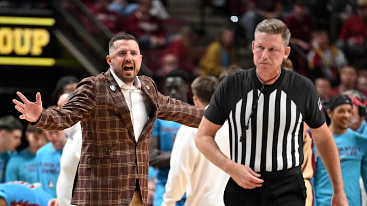 Feb 24, 2026; Tallahassee, Florida, USA; Florida State Seminoles head coach Luke Loucks exchanges words with a referee during the first half against the Miami Hurricanes at Donald L. Tucker Center. Mandatory Credit: Melina Myers-Imagn Images