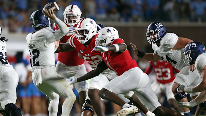 Sep 21, 2024; Oxford, Mississippi, USA; Mississippi Rebels defensive linemen William Echoles (52) and Princely Umanmielen (1) rush Georgia Southern Eagles quarterback JC French (12) as he throws during the first half at Vaught-Hemingway Stadium. Mandatory Credit: Petre Thomas-Imagn Images Sep 21, 2024; Oxford, Mississippi, USA; Mississippi Rebels defensive linemen William Echoles (52) and Princely Umanmielen (1) rush Georgia Southern Eagles quarterback JC French (12) as he throws during the first half at Vaught-Hemingway Stadium. Mandatory Credit: Petre Thomas-Imagn Images