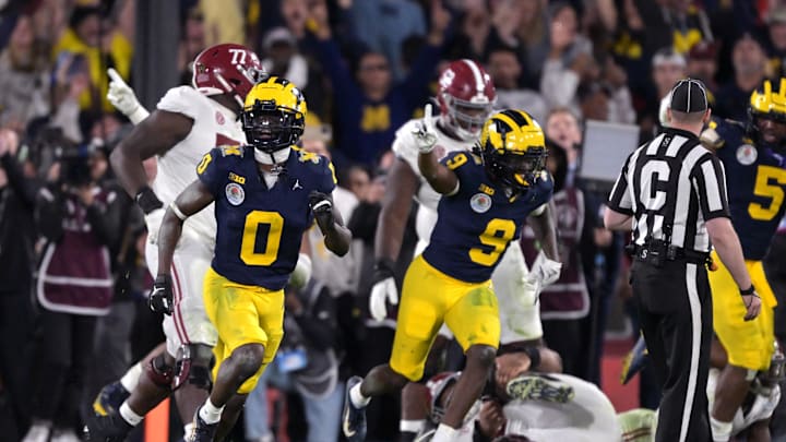Jan 1, 2024; Pasadena, CA, USA; Michigan Wolverines defensive back Mike Sainristil (0) and defensive back Rod Moore (9) celebrate after defeating the Alabama Crimson Tide in the 2024 Rose Bowl college football playoff semifinal game at Rose Bowl. Mandatory Credit: Jayne Kamin-Oncea-Imagn Images