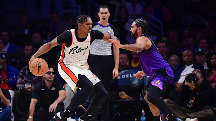 Dec 23, 2024; Los Angeles, California, USA; Detroit Pistons forward Ausar Thompson (9) moves the ball against Los Angeles Lakers guard Gabe Vincent (7) during the second half at Crypto.com Arena. Mandatory Credit: Gary A. Vasquez-Imagn Images