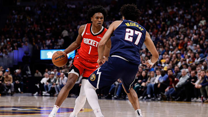 Jan 15, 2025; Denver, Colorado, USA; Houston Rockets forward Amen Thompson (1) controls the ball as Denver Nuggets guard Jamal Murray (27) guards in the second quarter at Ball Arena. Mandatory Credit: Isaiah J. Downing-Imagn Images Jan 15, 2025; Denver, Colorado, USA; Houston Rockets forward Amen Thompson (1) controls the ball as Denver Nuggets guard Jamal Murray (27) guards in the second quarter at Ball Arena. Mandatory Credit: Isaiah J. Downing-Imagn Images