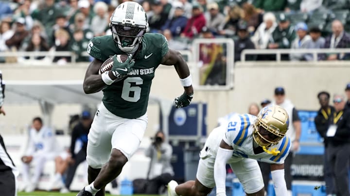 Oct 11, 2025; East Lansing, Michigan, USA; Michigan State wide receiver Nick Marsh (6) runs after catching the ball in the fourth quarter against the UCLA Bruins at Spartan Stadium. Mandatory Credit: Brendan Mullin-Imagn Images Oct 11, 2025; East Lansing, Michigan, USA; Michigan State wide receiver Nick Marsh (6) runs after catching the ball in the fourth quarter against the UCLA Bruins at Spartan Stadium. Mandatory Credit: Brendan Mullin-Imagn Images