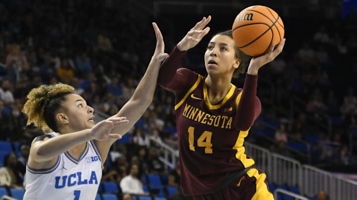 Feb 2, 2025; Los Angeles, California, USA; Minnesota Golden Gophers guard Tori McKinney (14) shoots over UCLA Bruins guard Kiki Rice (1) during the first quarter at Pauley Pavilion presented by Wescom. Mandatory Credit: Robert Hanashiro-Imagn Images
