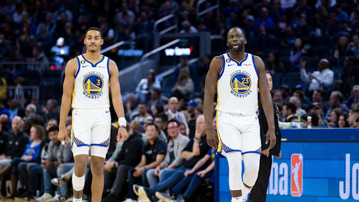 Oct 14, 2022; San Francisco, California, USA;  Golden State Warriors guard Jordan Poole (3) and forward Draymond Green (23) return to the court after a time-out taken by the Denver Nuggets during the first half at Chase Center. 