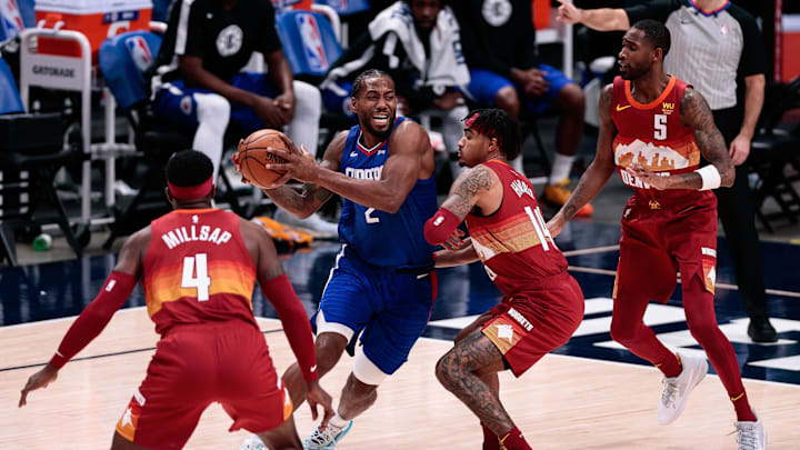 Three Nuggets defend the Clippers' Kawhi Leonard during their 2020 playoff series.
