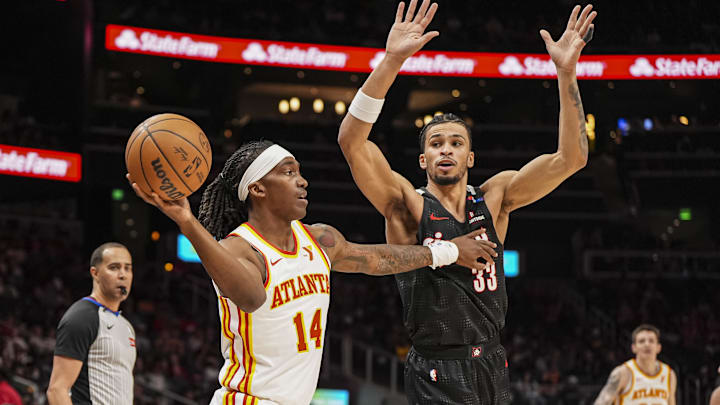 Apr 1, 2025; Atlanta, Georgia, USA; Atlanta Hawks guard Terance Mann (14) passes against Portland Trail Blazers forward Toumani Camara (33) during the first half at State Farm Arena. Mandatory Credit: Dale Zanine-Imagn Images Apr 1, 2025; Atlanta, Georgia, USA; Atlanta Hawks guard Terance Mann (14) passes against Portland Trail Blazers forward Toumani Camara (33) during the first half at State Farm Arena. Mandatory Credit: Dale Zanine-Imagn Images