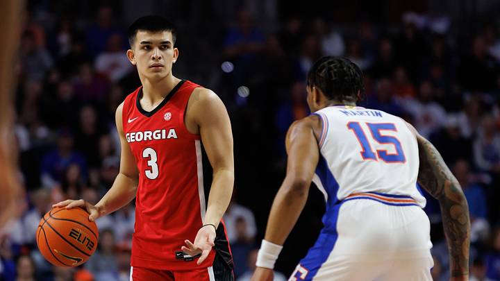 Jan 25, 2025; Gainesville, Florida, USA; Georgia Bulldogs guard Savo Drezgic (3) dribbles the ball while Florida Gators guard Alijah Martin (15) defends during the first half at Exactech Arena at the Stephen C. O'Connell Center. Jan 25, 2025; Gainesville, Florida, USA; Georgia Bulldogs guard Savo Drezgic (3) dribbles the ball while Florida Gators guard Alijah Martin (15) defends during the first half at Exactech Arena at the Stephen C. O'Connell Center.