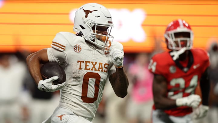 Dec 7, 2024; Atlanta, GA, USA; Texas Longhorns wide receiver DeAndre Moore Jr. (0) makes a touchdown catch against the Georgia Bulldogs during the second half in the 2024 SEC Championship game at Mercedes-Benz Stadium. Mandatory Credit: Brett Davis-Imagn Images