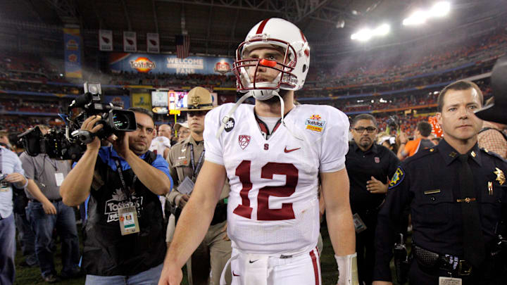 Stanford's Andrew Luck (12) walks of the field after losing the Fiesta Bowl between the Oklahoma State University Cowboys (OSU) and the Stanford Cardinal at the University of Phoenix Stadium in Glendale, Ariz., Tuesday, Jan. 3, 2012.

Osu101